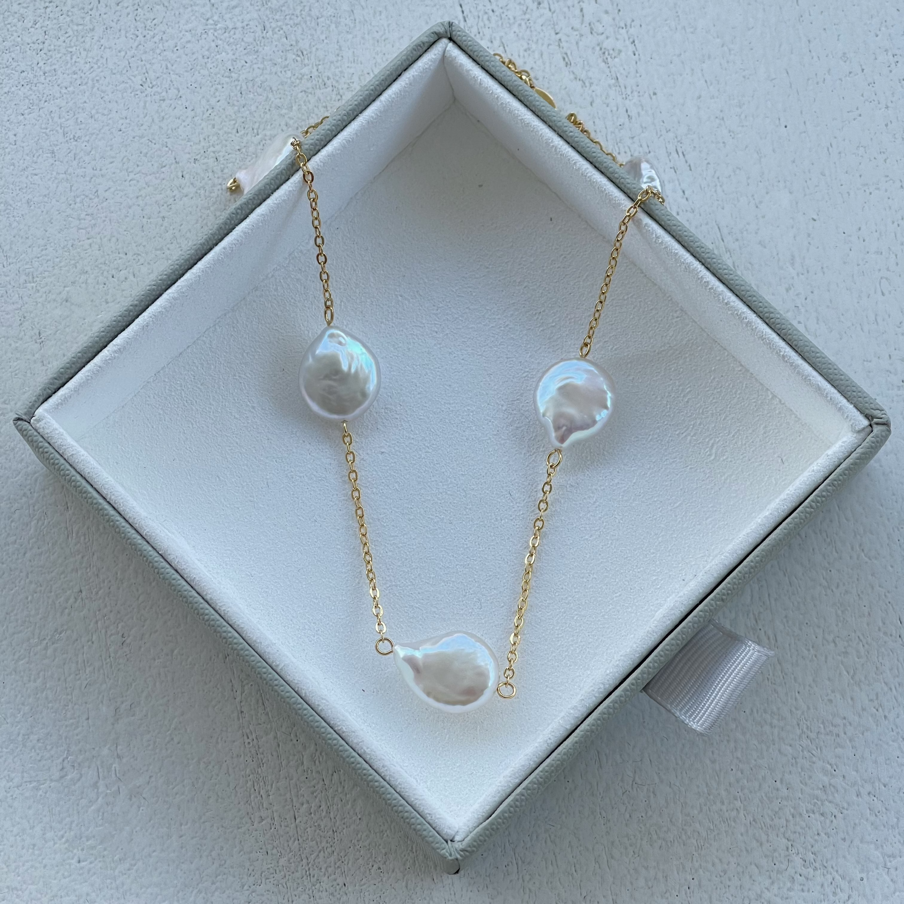 freshwater pearl necklace with gold in a box
