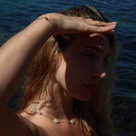 Woman in Paula Freshwater Pearl Necklace at the beach